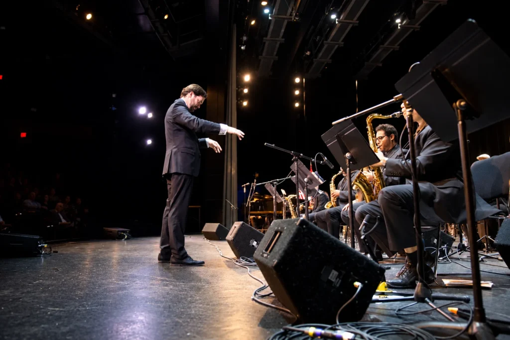 Lorenzo Ferrero conducting the Afro-Peruvian Jazz Orchestra from the stage in Washington, DC