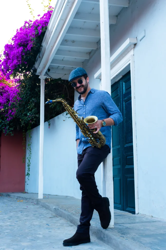 Lorenzo Ferrero outdoors holding his saxophone